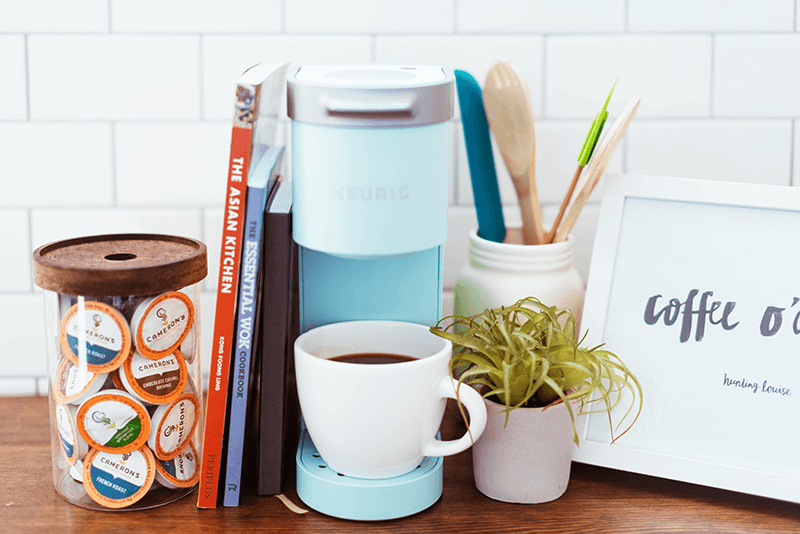 Cameron's Coffee 12-ct. EcoPods on counter with k-cup brewer